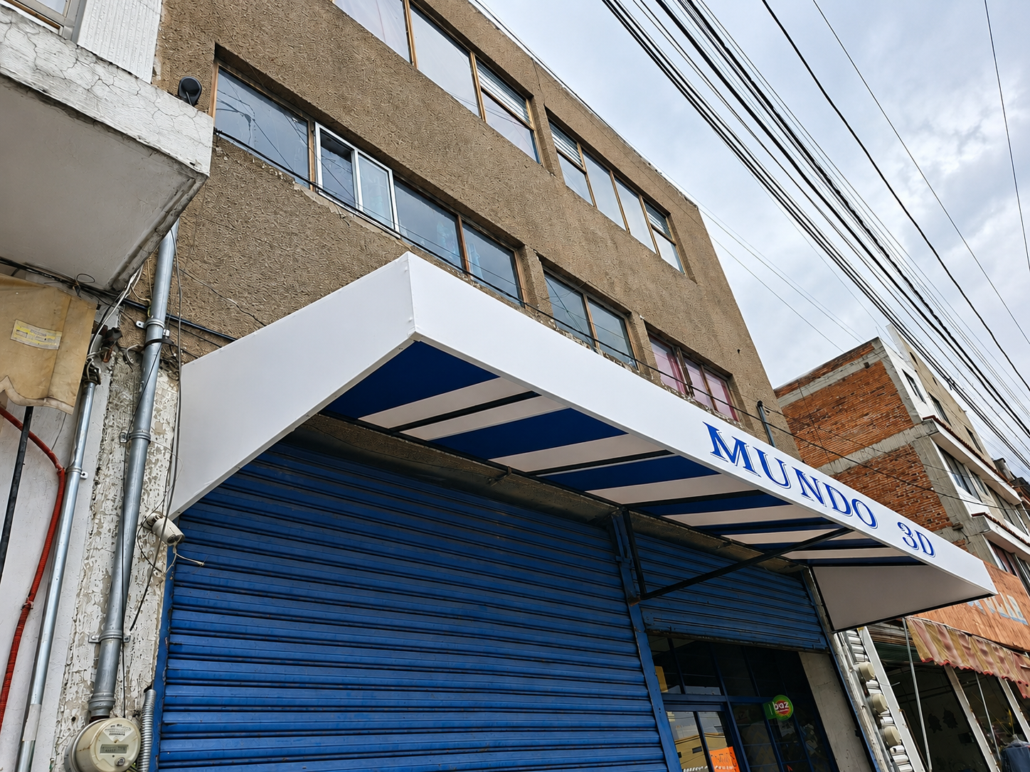 Toldo fijo lona-enrollable-carniceria